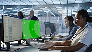 IT professional coding on chroma key PC in data center photo