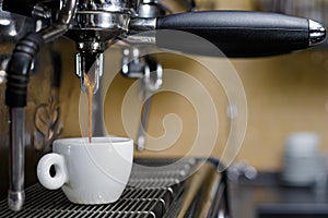 Professional coffee machine making espresso