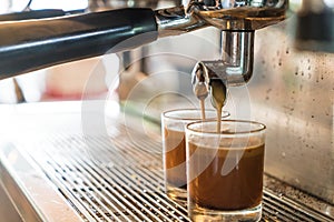 Professional coffee machine making espresso in a cafe