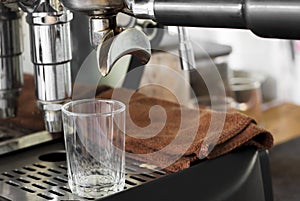 Professional coffee machine making espresso in a cafe