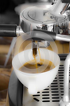 Professional coffee machine making espresso in a cafe, concept b