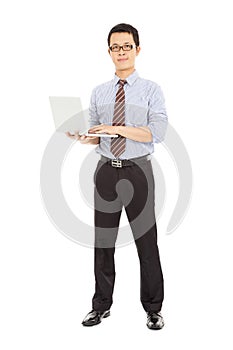 Professional computer engineer standing and holding the laptop