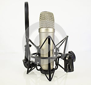 A professional condenser microphone  for audio usage including a pop filter