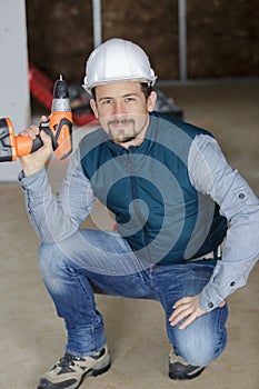 Professional construction labourer looking at camera