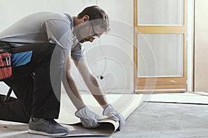 Contractor removing an old linoleum flooring