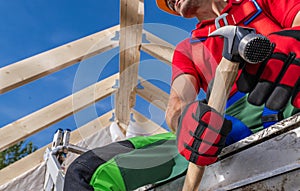 Professional Contractor Worker with Large Hammer in His Hands