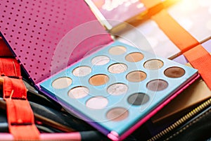 Professional cosmetics, eye shadow palette, warm brown shades. Decorative cosmetics for eye makeup, close-up