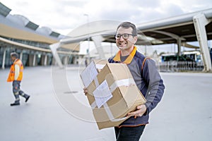 Professional courier with a parcel  delivering to a business area