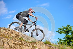 Professional Cyclist Riding the Bike on Beautiful Spring Mountain Trail. Extreme Sports