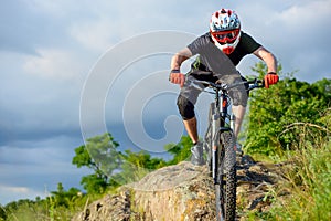 Professional Cyclist Riding the Bike on Beautiful Spring Mountain Trail. Extreme Sports
