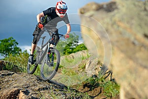 Professional Cyclist Riding the Bike on Beautiful Spring Mountain Trail. Extreme Sports