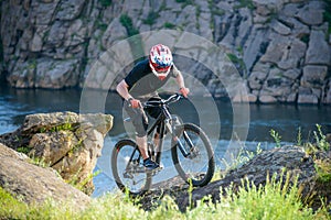 Professional Cyclist Riding the Bike on Beautiful Spring Mountain Trail. Extreme Sports