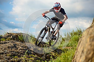 Professional Cyclist Riding the Bike on Beautiful Spring Mountain Trail. Extreme Sports