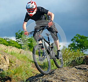 Professional Cyclist Riding the Bike on Beautiful Spring Mountain Trail. Extreme Sports