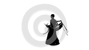 Professional dancer girl is dancing with a manton . White background. Silhouette. Slow motion