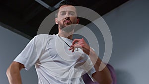 Professional dancer looking camera while performance. Guy dancing in class.