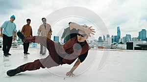 Professional dancer practice B boy dance with friends at roof top. Endeavor.