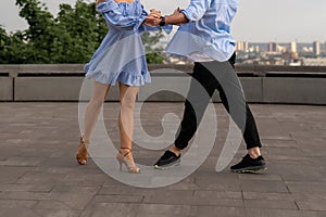 Professional dancers legs. Couple man and woman are dancing on the street