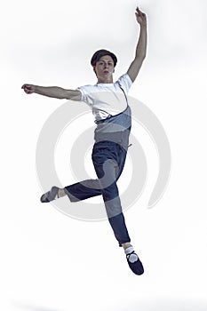 Professional Dancing Caucasian Male Ballet Dancer Performing in Flight With Hands Outspread in Studio Over White Background