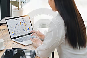 Professional data analyst using data visualizations dashboard on computer monitor for data business analysis and Data