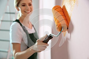 Professional decorator painting wall. Home repair service