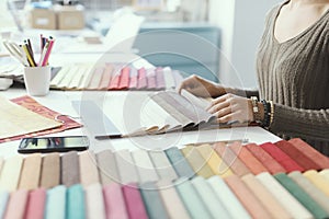 Professional decorator picking fabric swatches