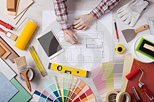 Professional decorator working at desk