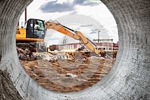 Professional demolition of reinforced concrete structures using industrial hydraulic hammer with excavator. Rods of metal fittings