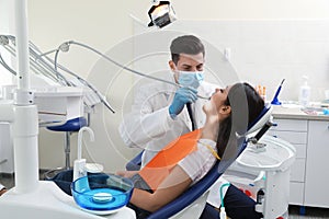 Professional dentist working with patient