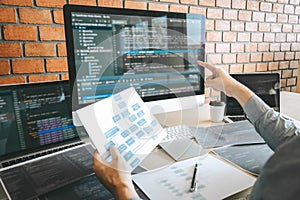 Professional Developer programmer working a software website design and coding technology, writing codes and database in company