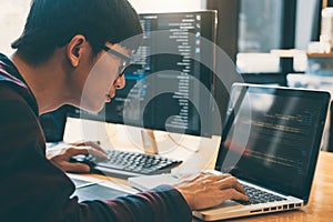 Professional Development programmer working in programming website a software and coding technology, writing codes and data