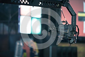 Professional digitak video camera on crane record live on event broadcasting at night concert outdoors