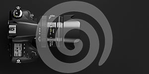 Professional digital photo camera on black background. Top view and space for text photo