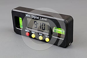 Professional digital tool inclinometer isolated on grey background