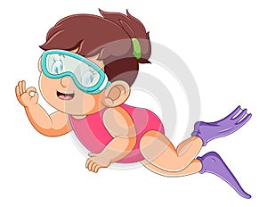 The professional diver girl is diving under the water