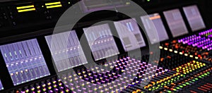 Professional DJ sound mixer. Professional Recording Mixer Console Broadband telecommunication. blurred background.