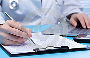 Professional Doctor sign Health care medical document of patient medicine in hospital office. Doctor wear lab coat uniform read