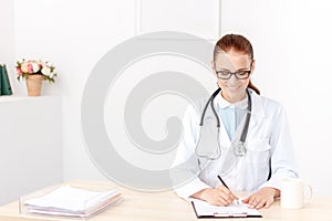 Professional doctor sitting at the table