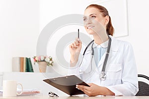 Professional doctor sitting at the table