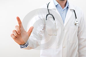 Professional doctor touching a touchscreen interface