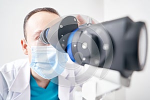 Professional doctor using biomicroscope in the hospital