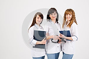 Professional doctor working in hospital office with nurses. Medical technology research institute and doctor staff service concept