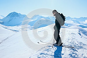 Professional downhill skier on top of mountain