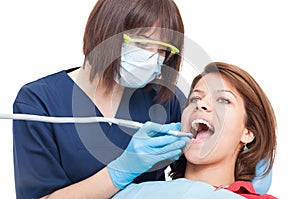 Professional drilling procedure at dentist on white background