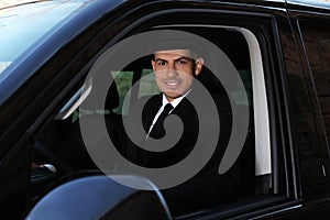 Professional driver in luxury car. Chauffeur service