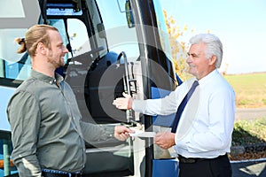 Professional driver taking ticket from passenger