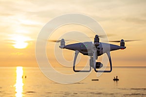 Professional drone quad copter with digital camera at sunset ready to fly for surveillance. close-up of Rotor UAV. four