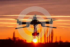 Professional drone silhouette in the sunset