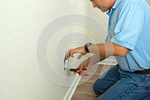 Professional electrician or experienced homeowner fixing broken