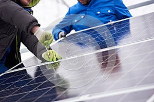 Professional electrician worker installing solar panels